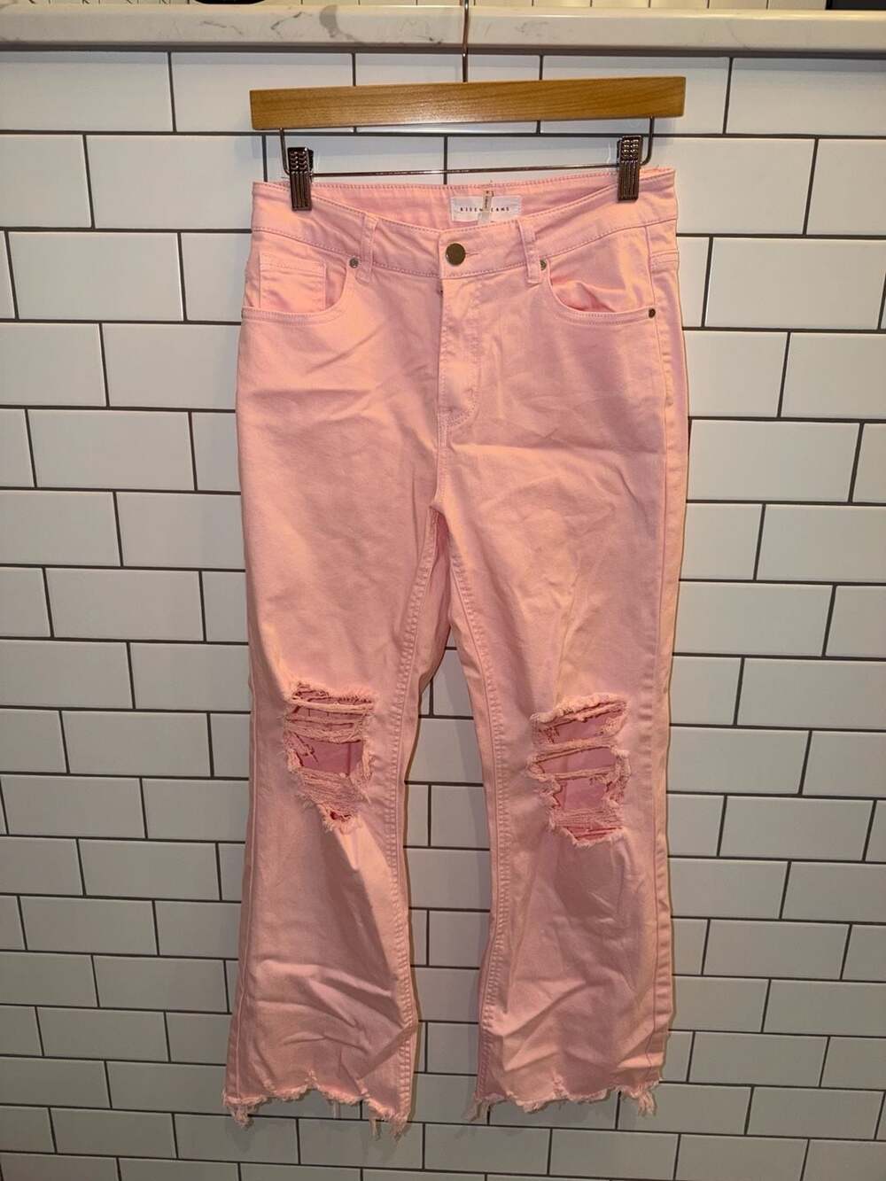 Size 3. 
Risen Jeans High-Rise Distressed Pink Cropped Flare Jeans